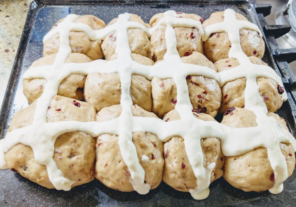 Buns with crosses, ready to be baked