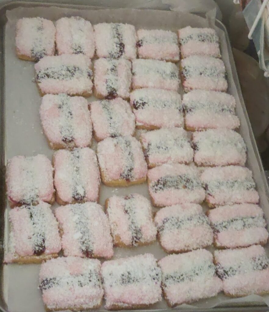 Iced Vovos topped with coconut and icing sugar 